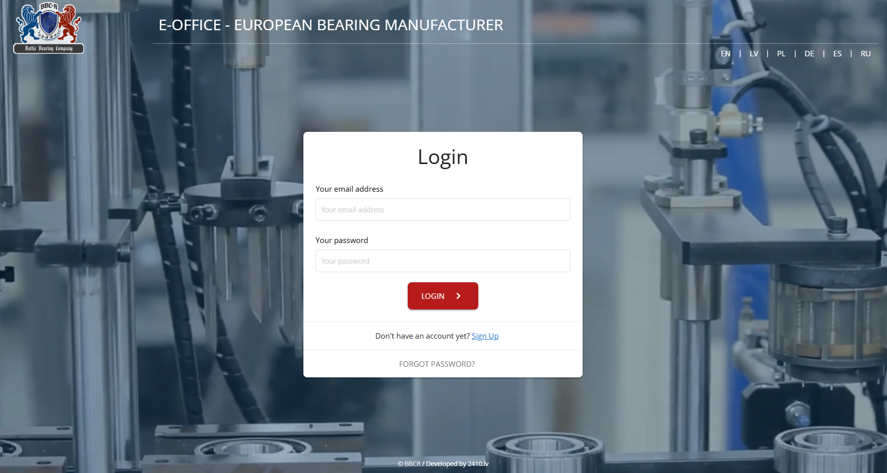Écran de connexion du portail E-Bureau avec sélecteur multilingue et vidéo de fond de la ligne de production.